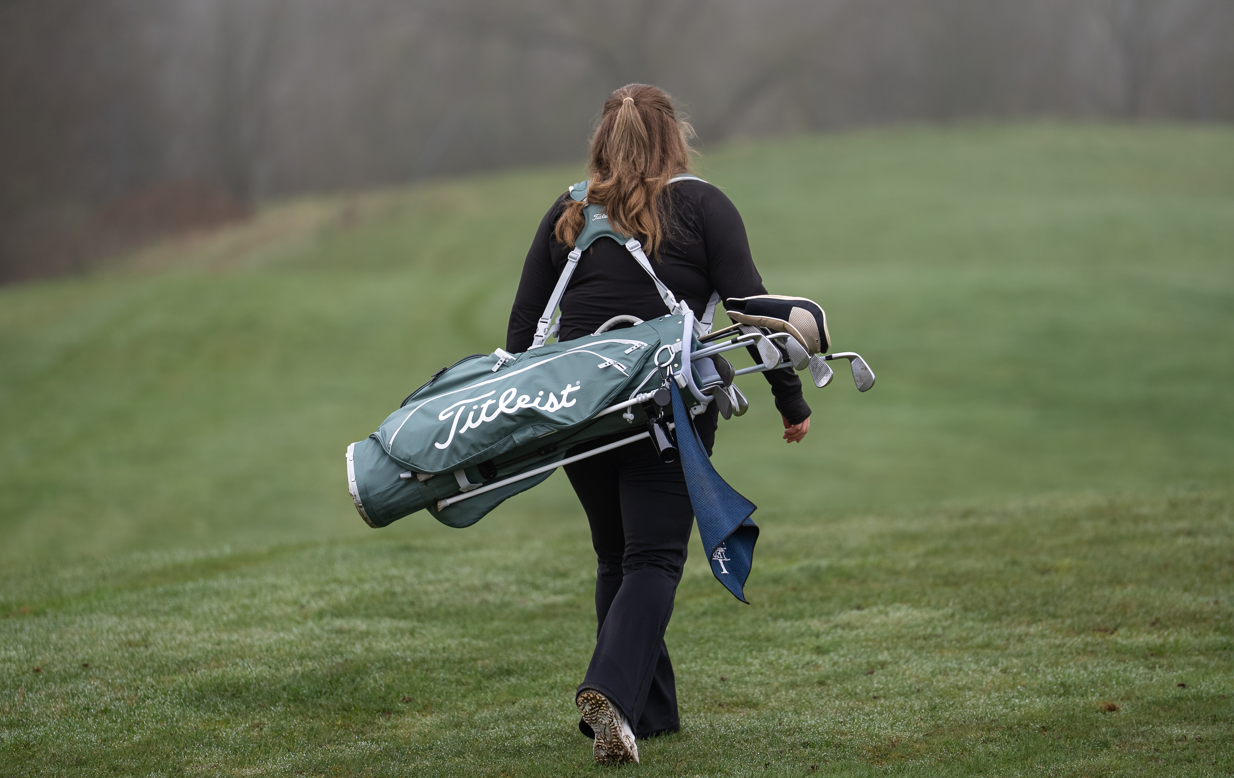 Golfer putting on the green