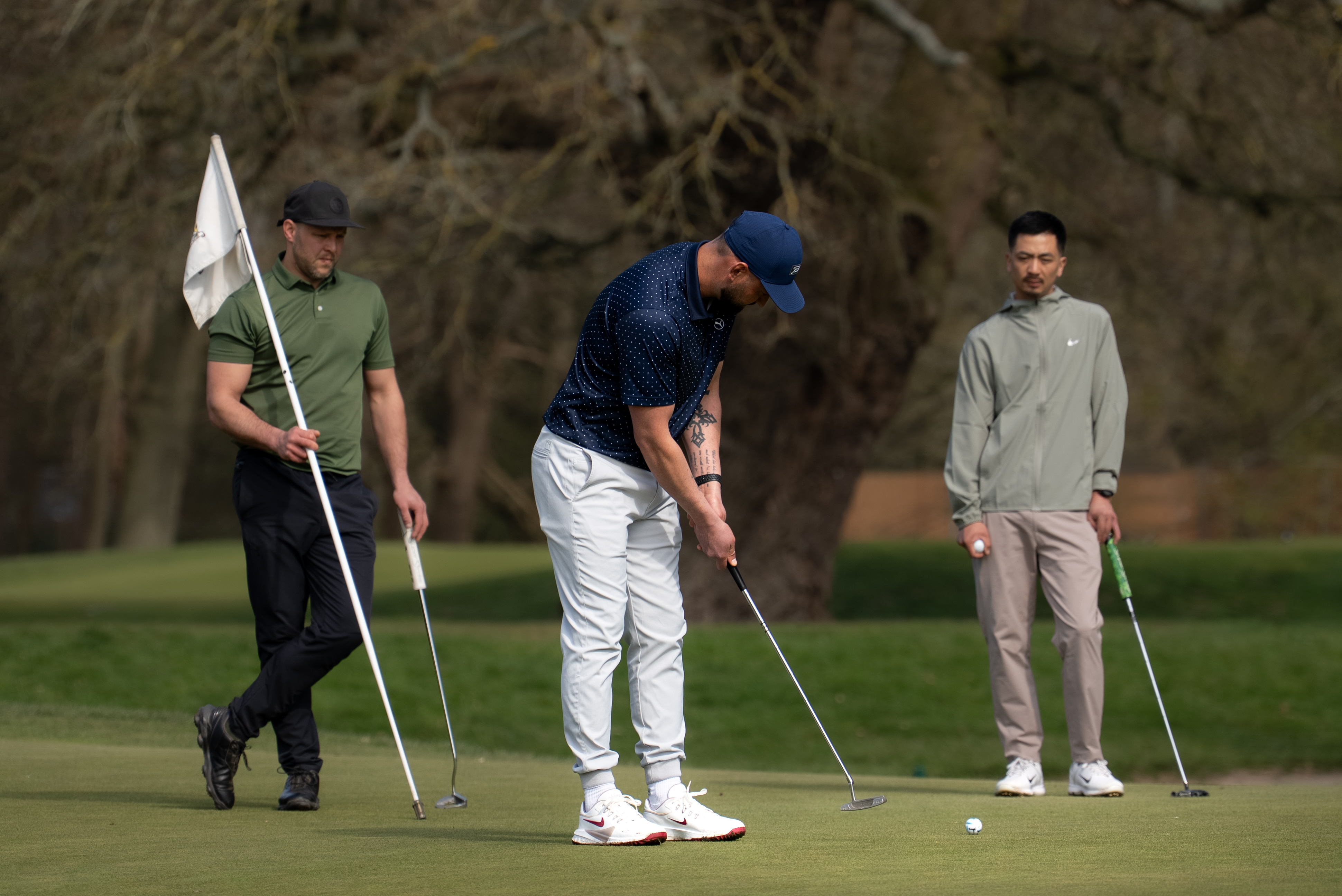 Golfers standing together on the course