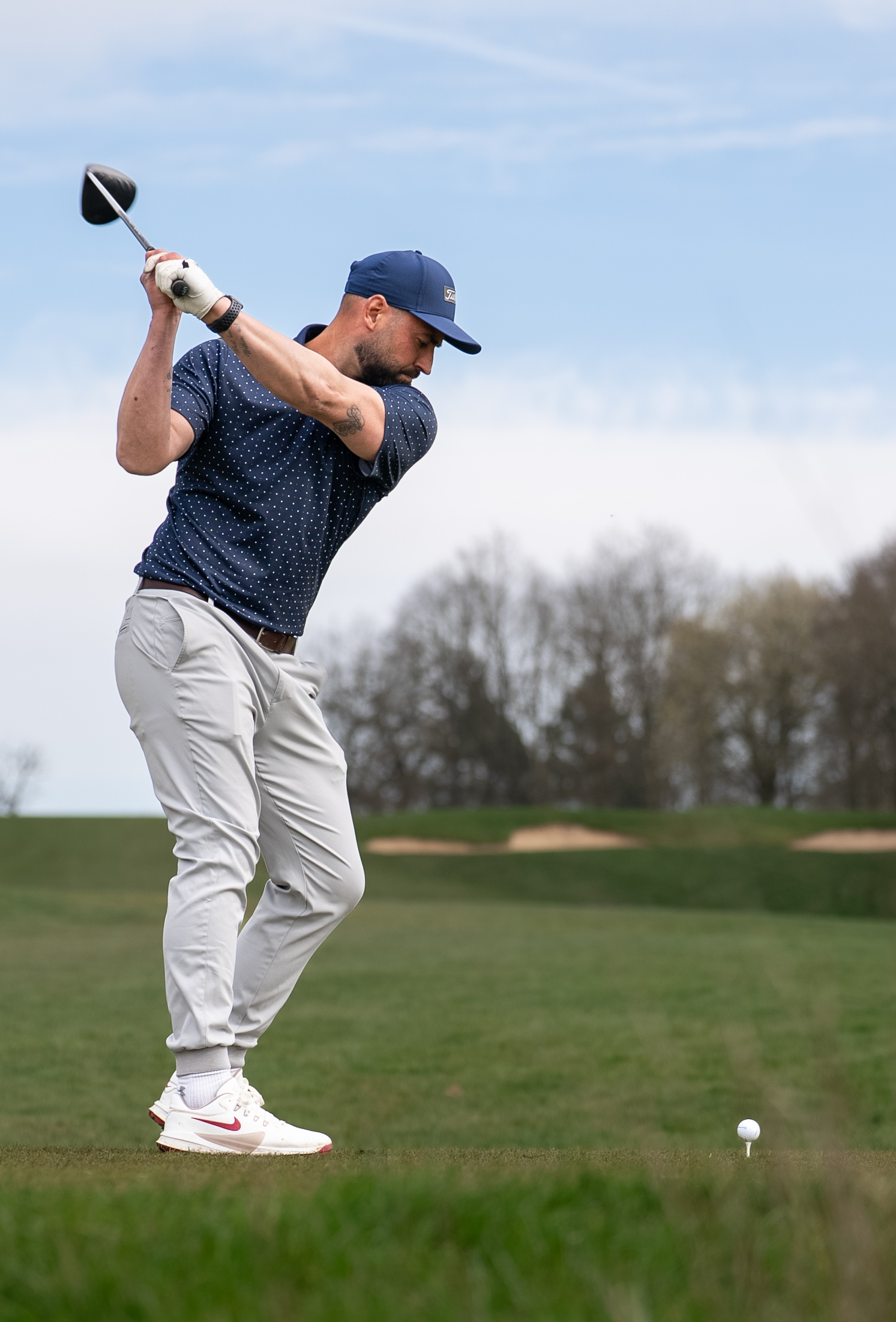 Golfer playing a shot on the course
